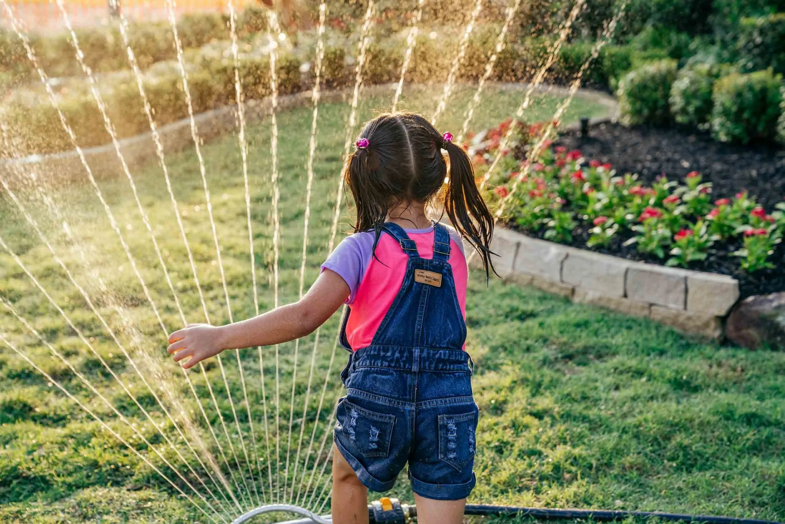 Girl-Playing-in-Sprinkler.jpg