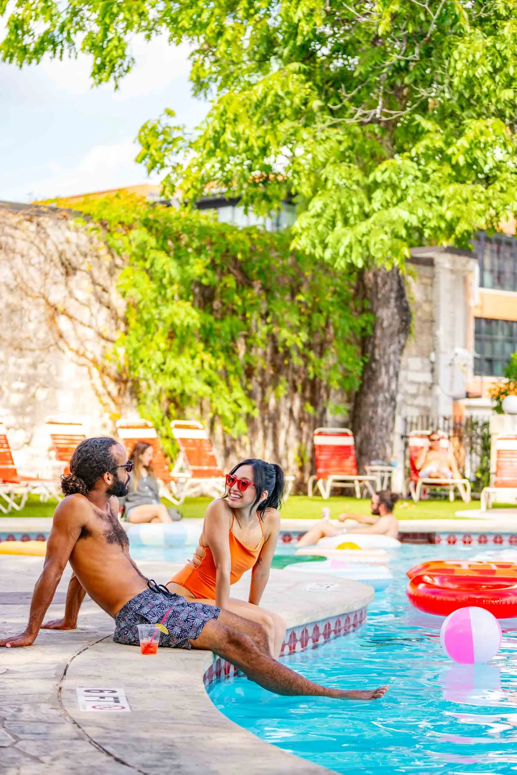 Couple-Relaxing-Poolside.jpg