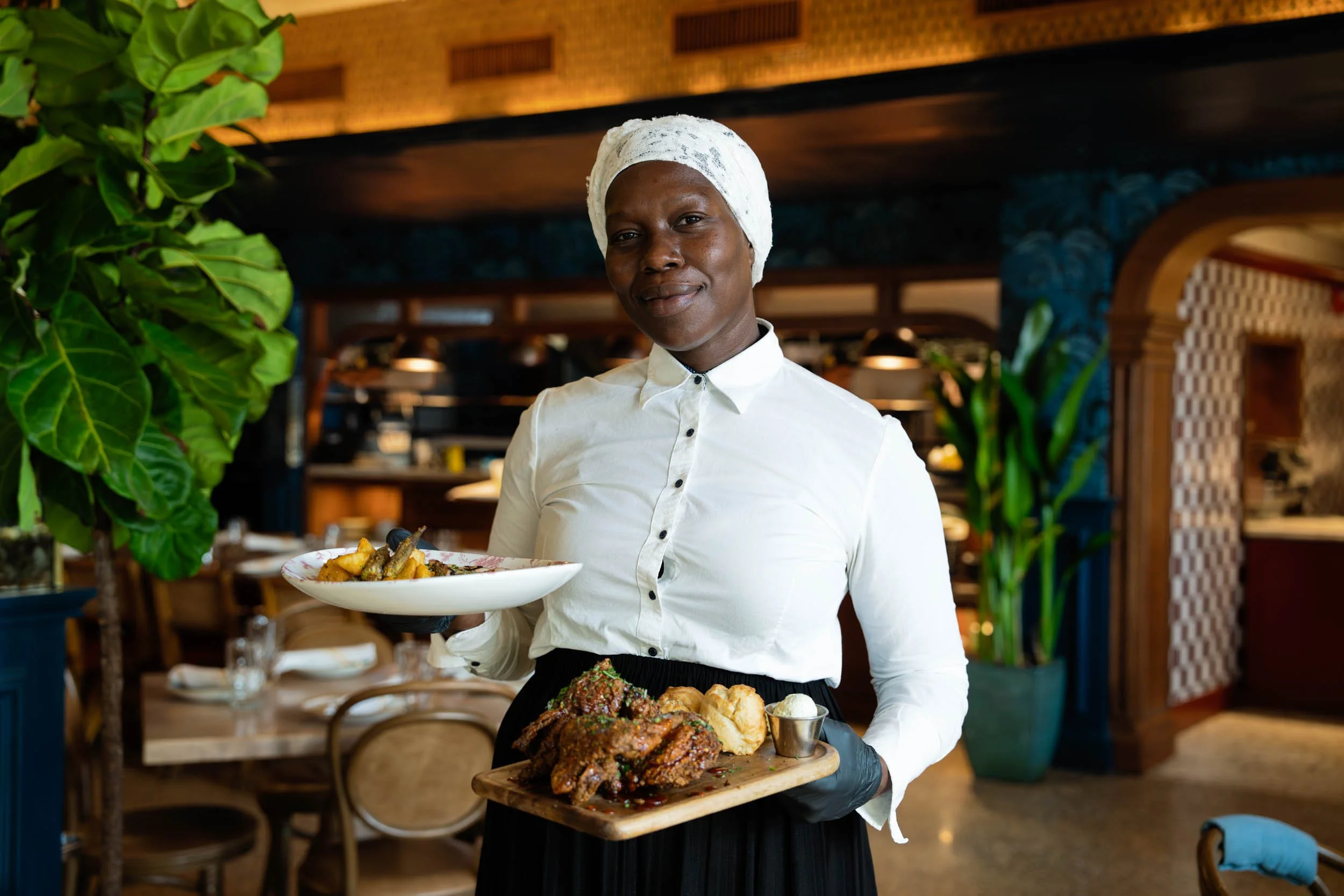 Woman-Holding-Food-in-Restaurant.jpg