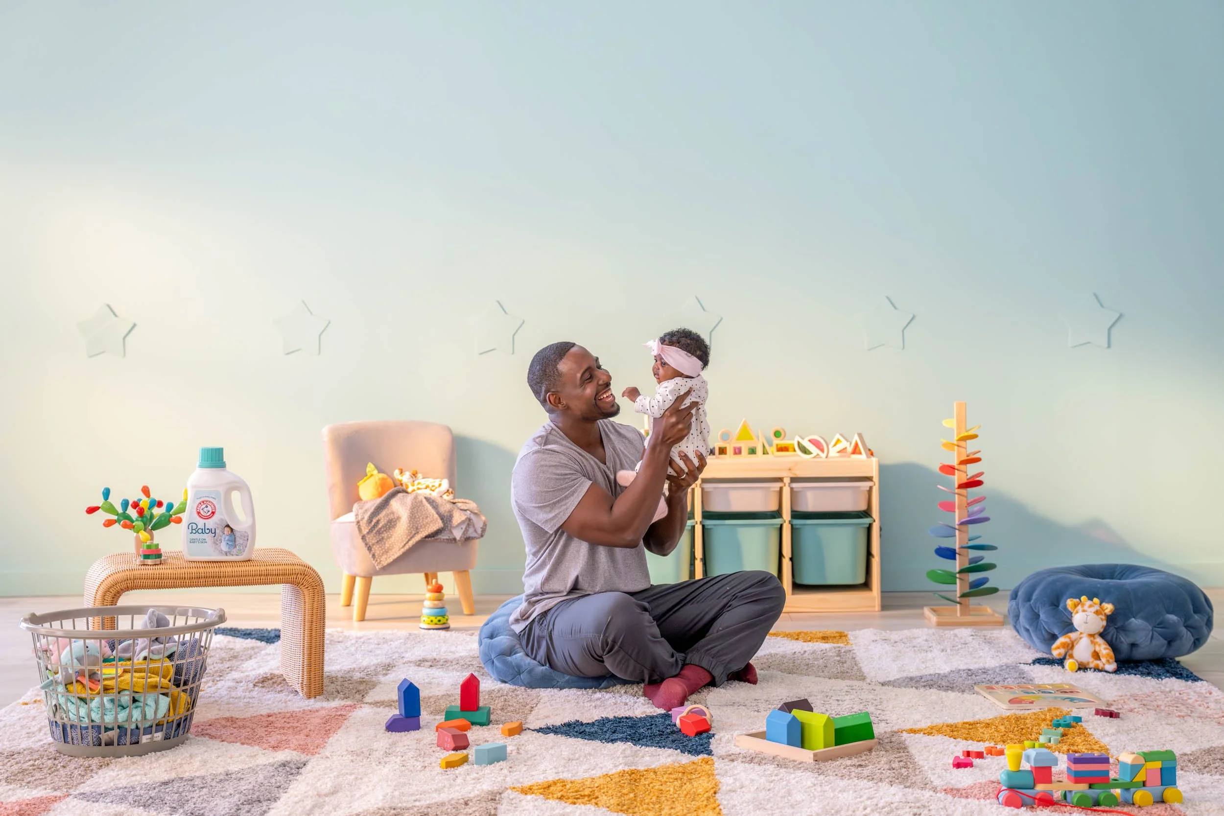 Man-Playing-With-Baby-in-Nursery.jpg