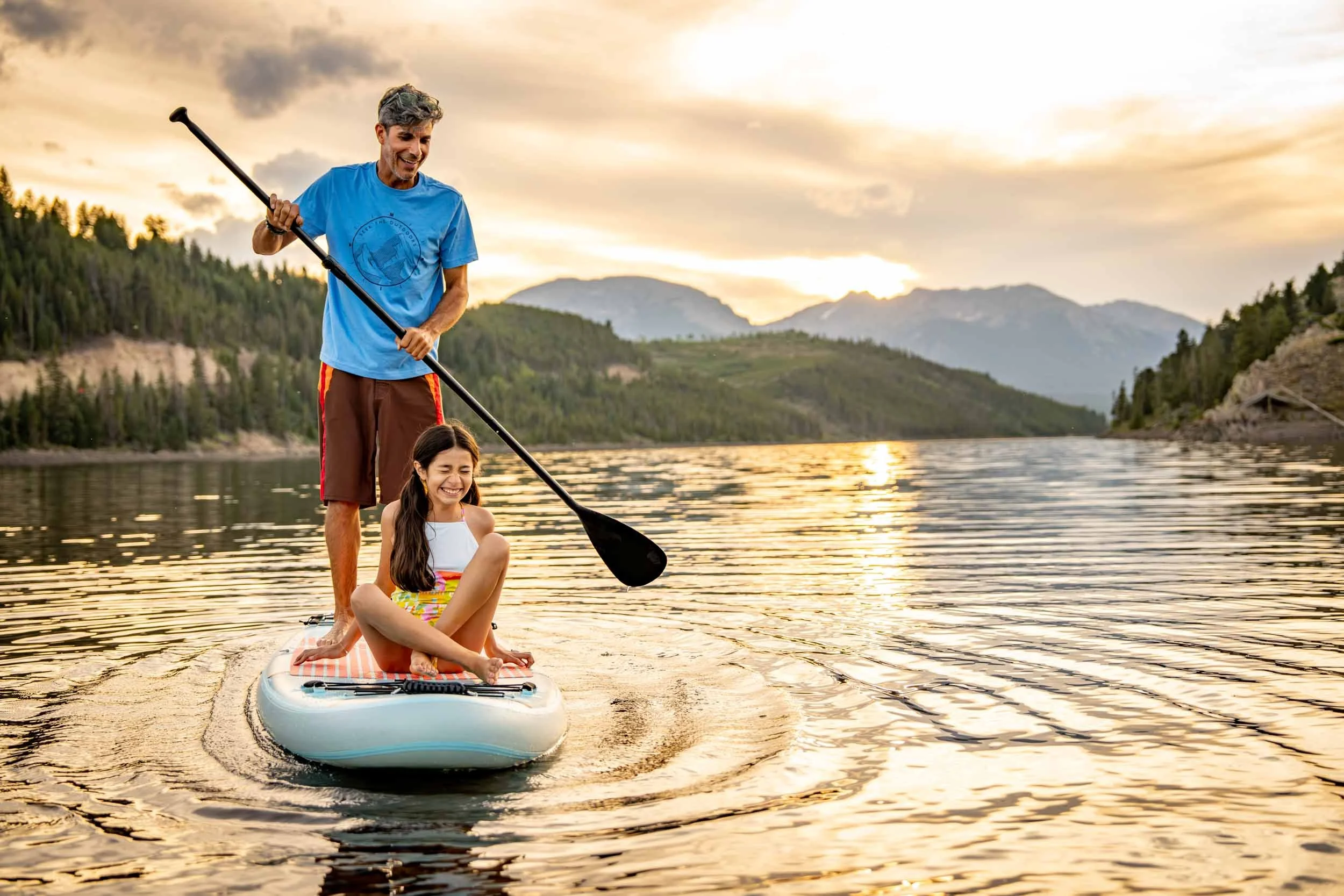 Man-and-Girl-Paddleboarding-on-Lake.jpg