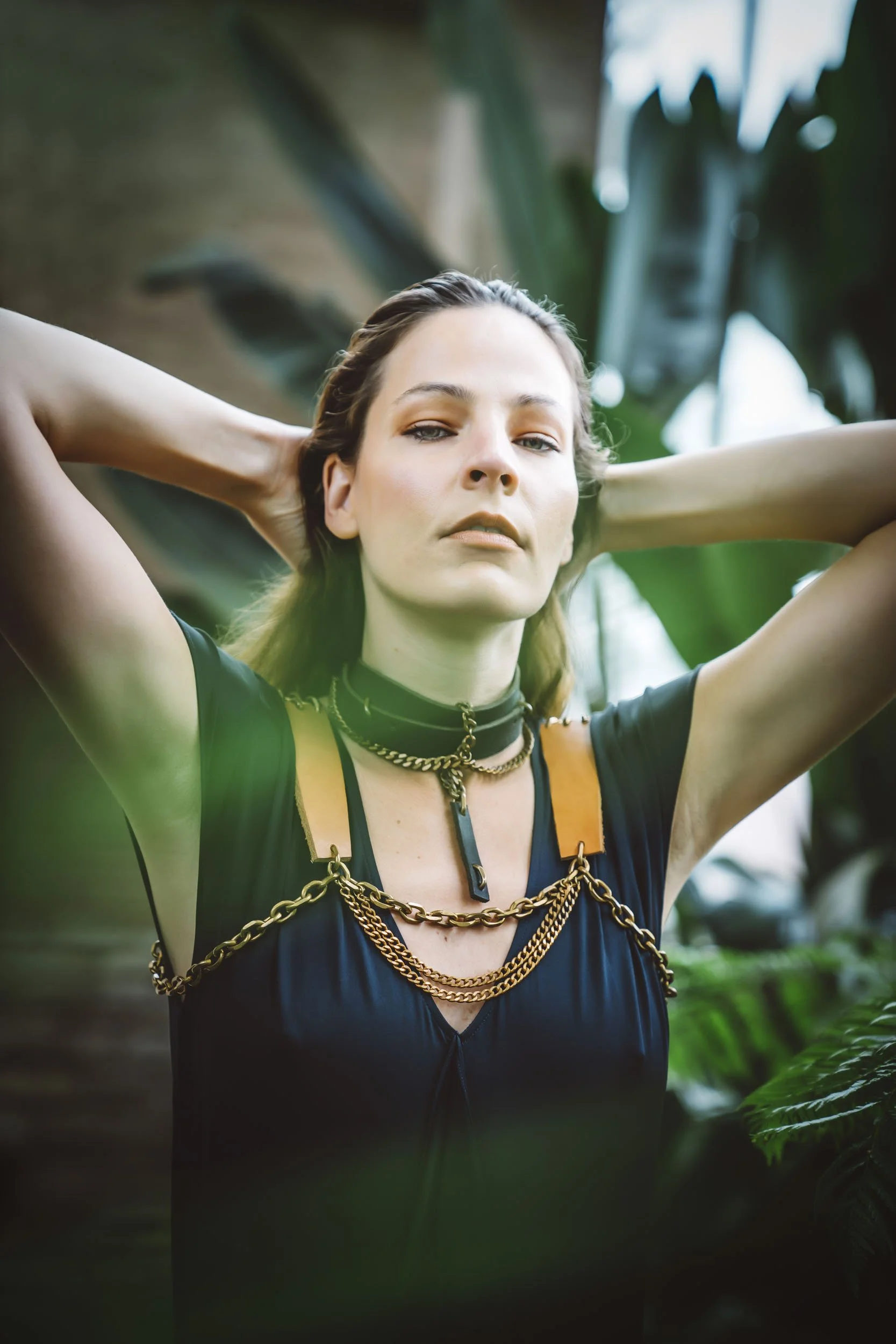 Woman-wearing-brass-leather-harness-and-collar.JPG