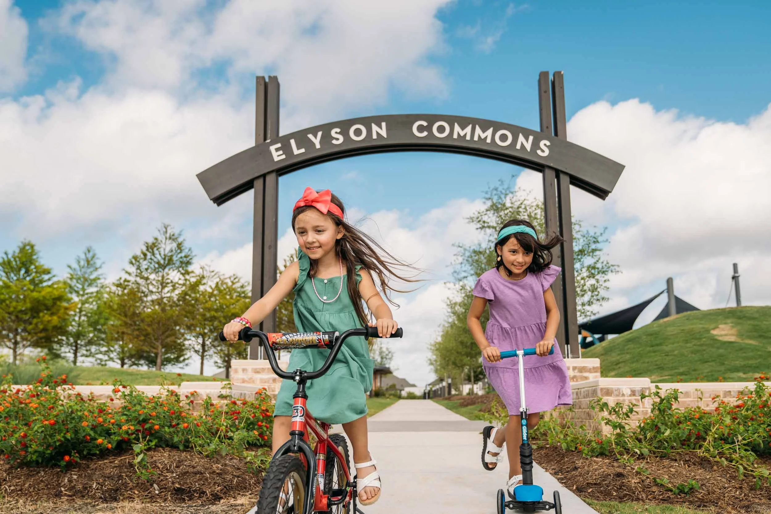 Kids-Biking-and-Scootering-at-Elyson-Commons.jpg