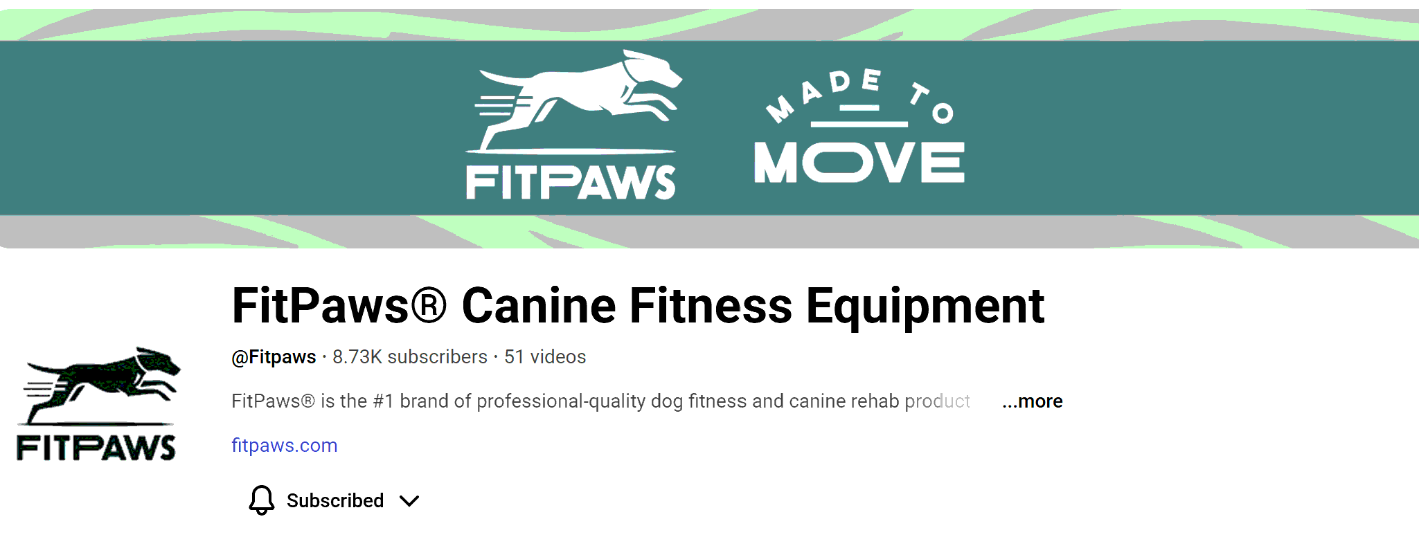 Person sitting and writing on a tablet with a stylus, dogs in the background, one with a harness.