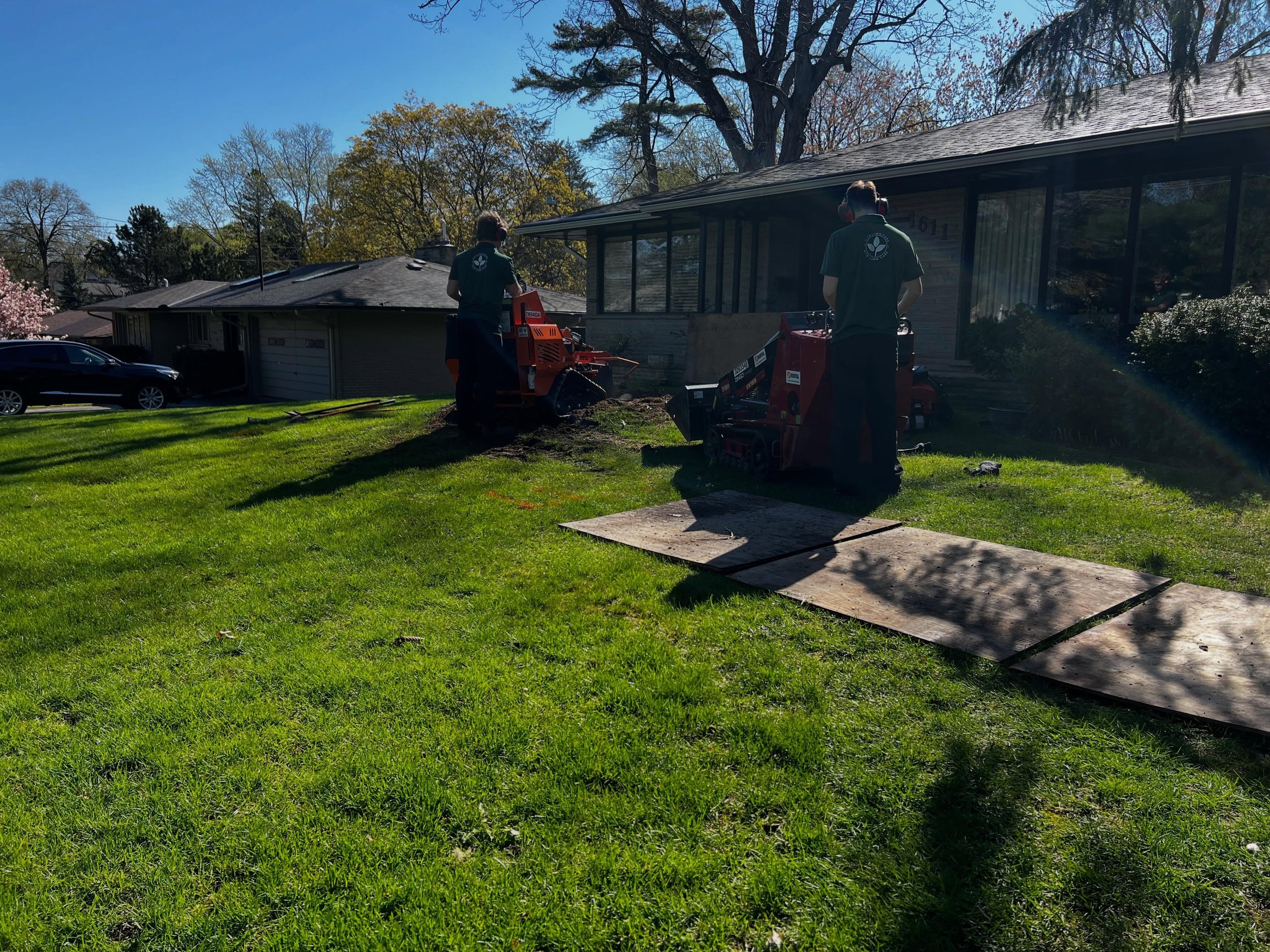 Stump grinding, complete re-leveling then re-sodding to clean it up