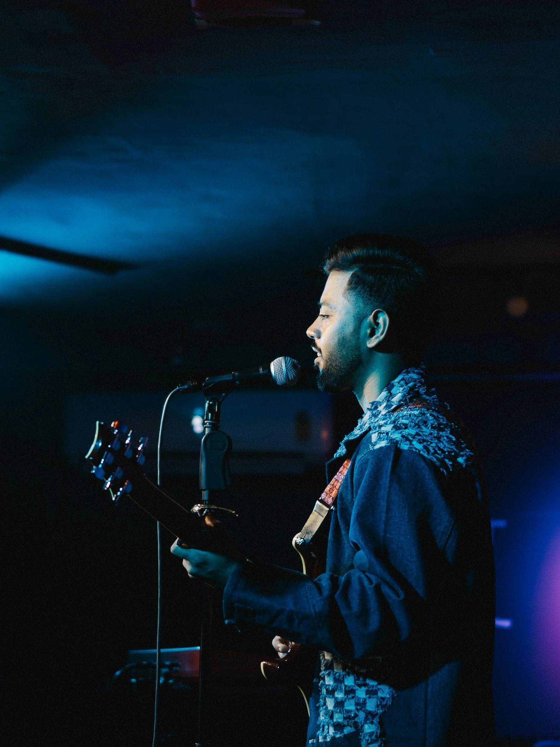 A singer on stage moments before performance.