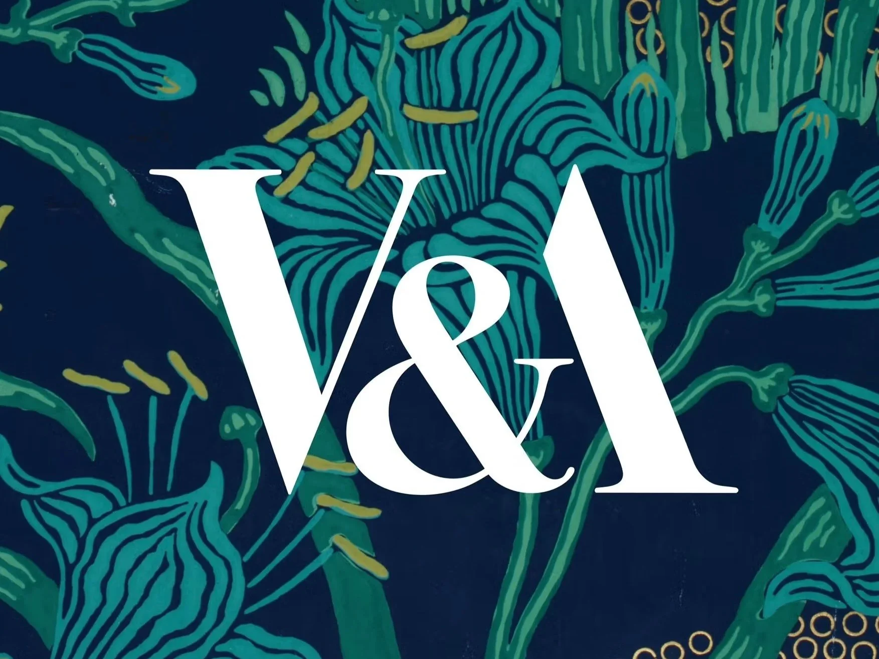 The image features a dark blue background with an abstract floral design in green, blue, and yellow. Overlaid in large white text are the characters 'V&A' with a stylized ampersand.