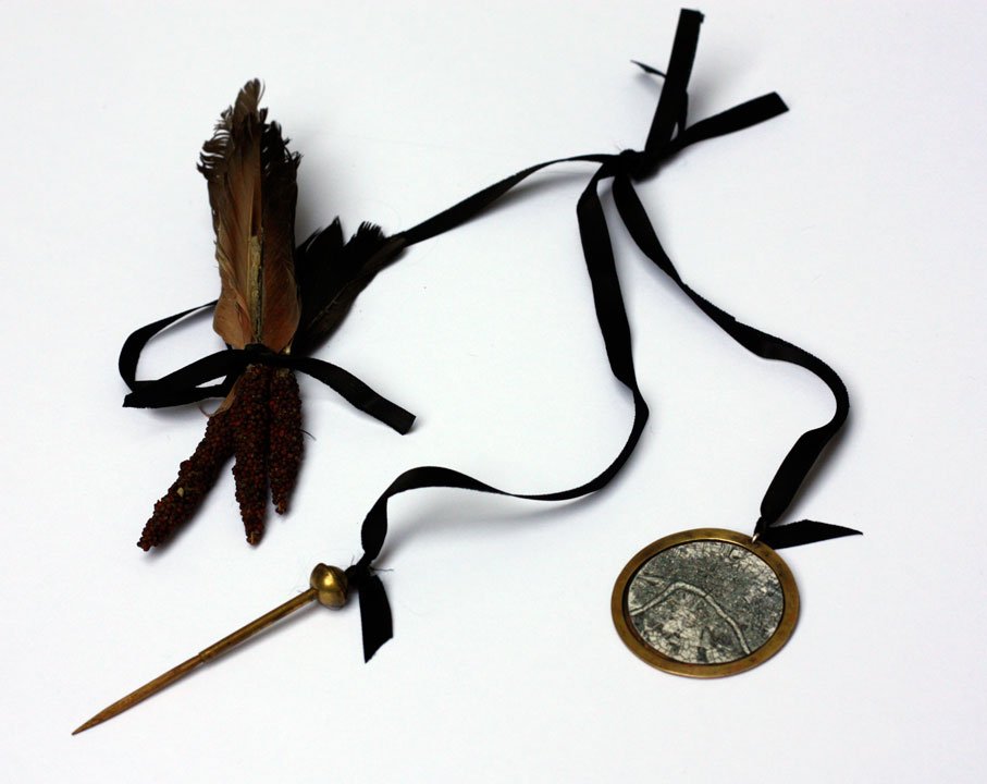 This altered archery scoring kit is a middle-class lady’s attempt to discreetly sow fruit and vegetable seeds to help feed those less fortunate. 