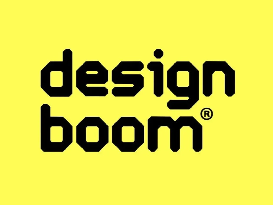 Black text 'design boom' on a yellow background.