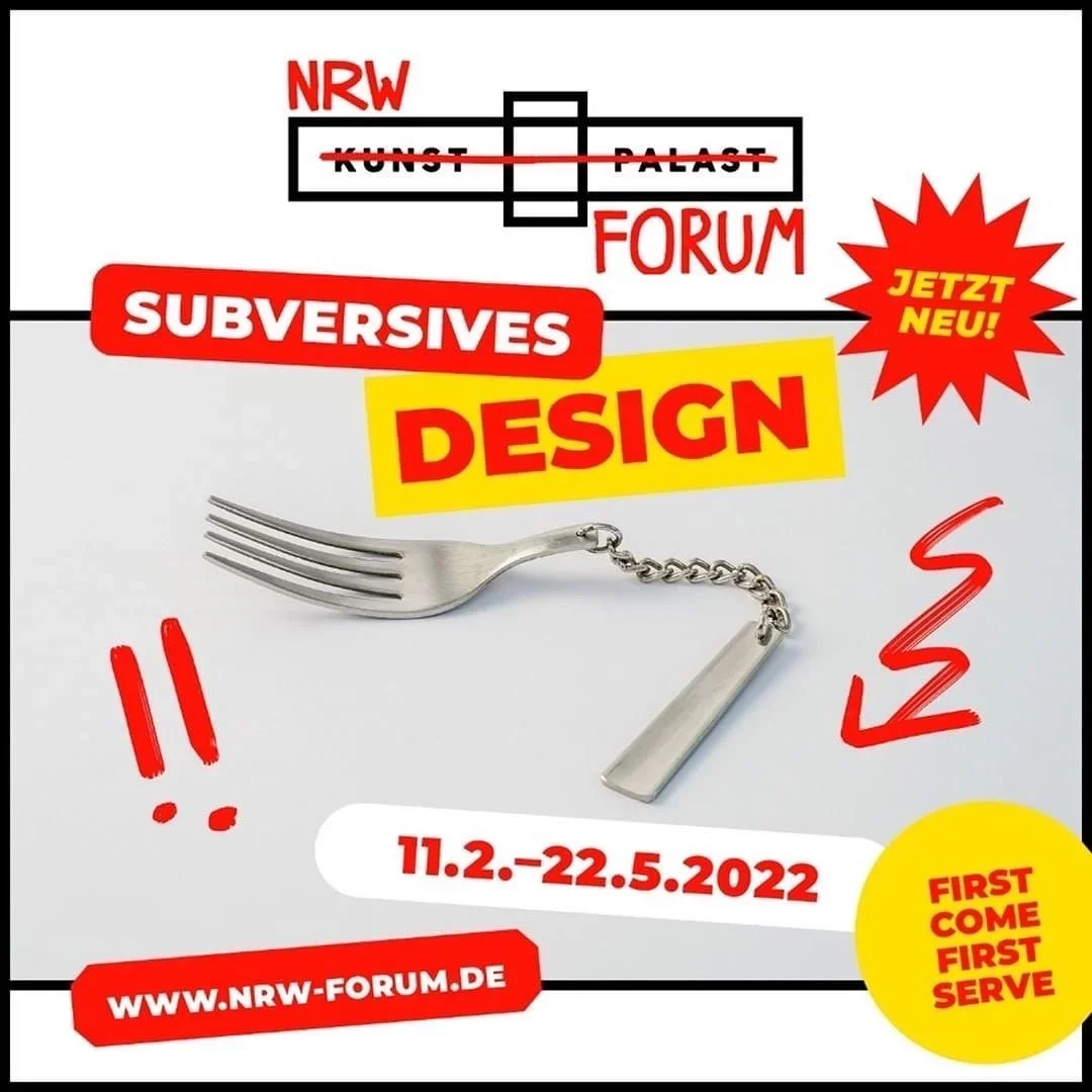 Graphic design poster with text promoting an event called 'NRW Forum'. The poster features a fork with the tines and handle connected by a chain, resembling a zipper. The background includes red, yellow, black, and white elements, with phrases like 'Subversives Design', 'Jetz Neu!', 'First Come First Serve', and the date '11.2-22.5.2022'. The website URL 'www.nrw-forum.de' is also included.