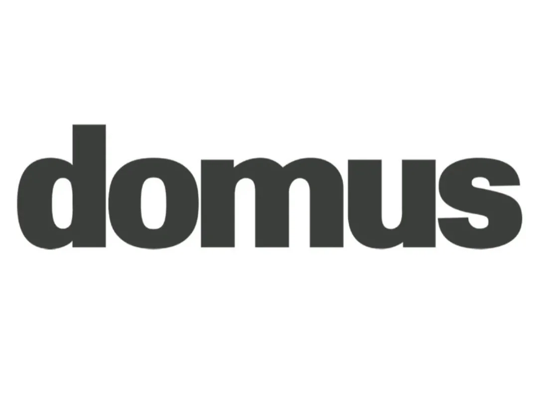 Black text spelling out 'domus' on a white background.
