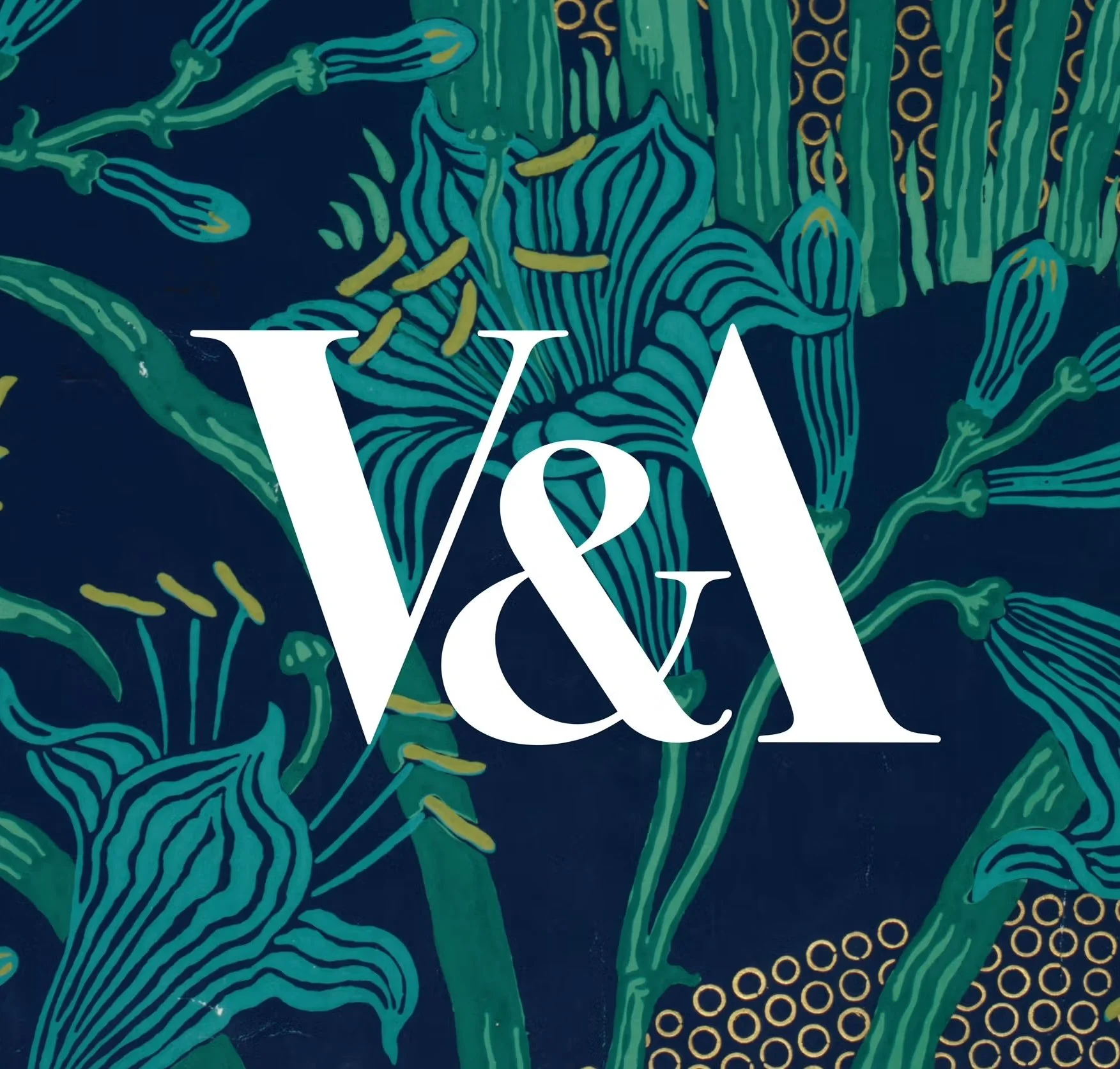 A floral pattern with stylized green flowers and yellow accents on a dark blue background, with a white 'V&A' logo in the center.