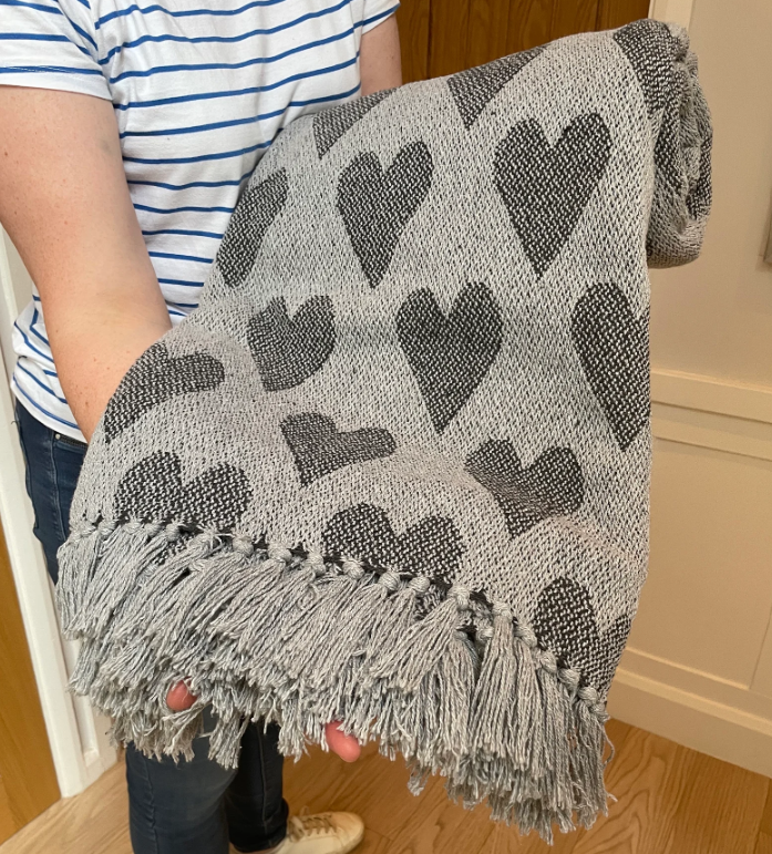 grey hearts blanket.png