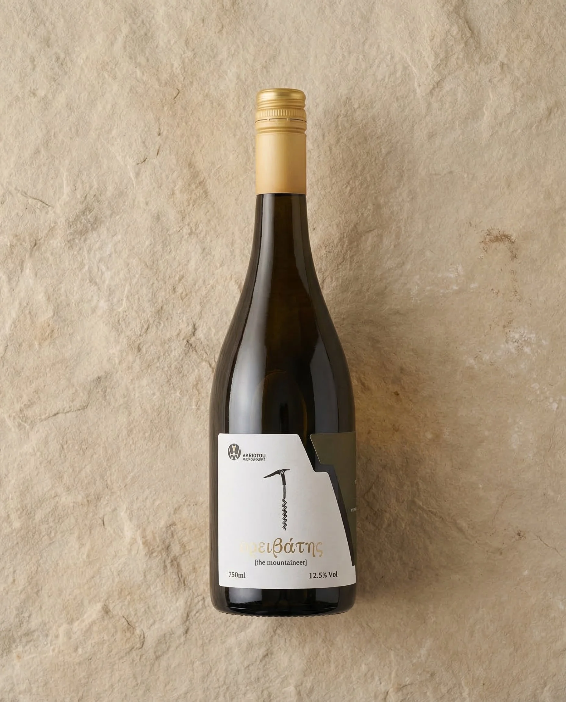 A dark glass wine bottle with a beige screw cap and a white label, placed on a textured beige surface.