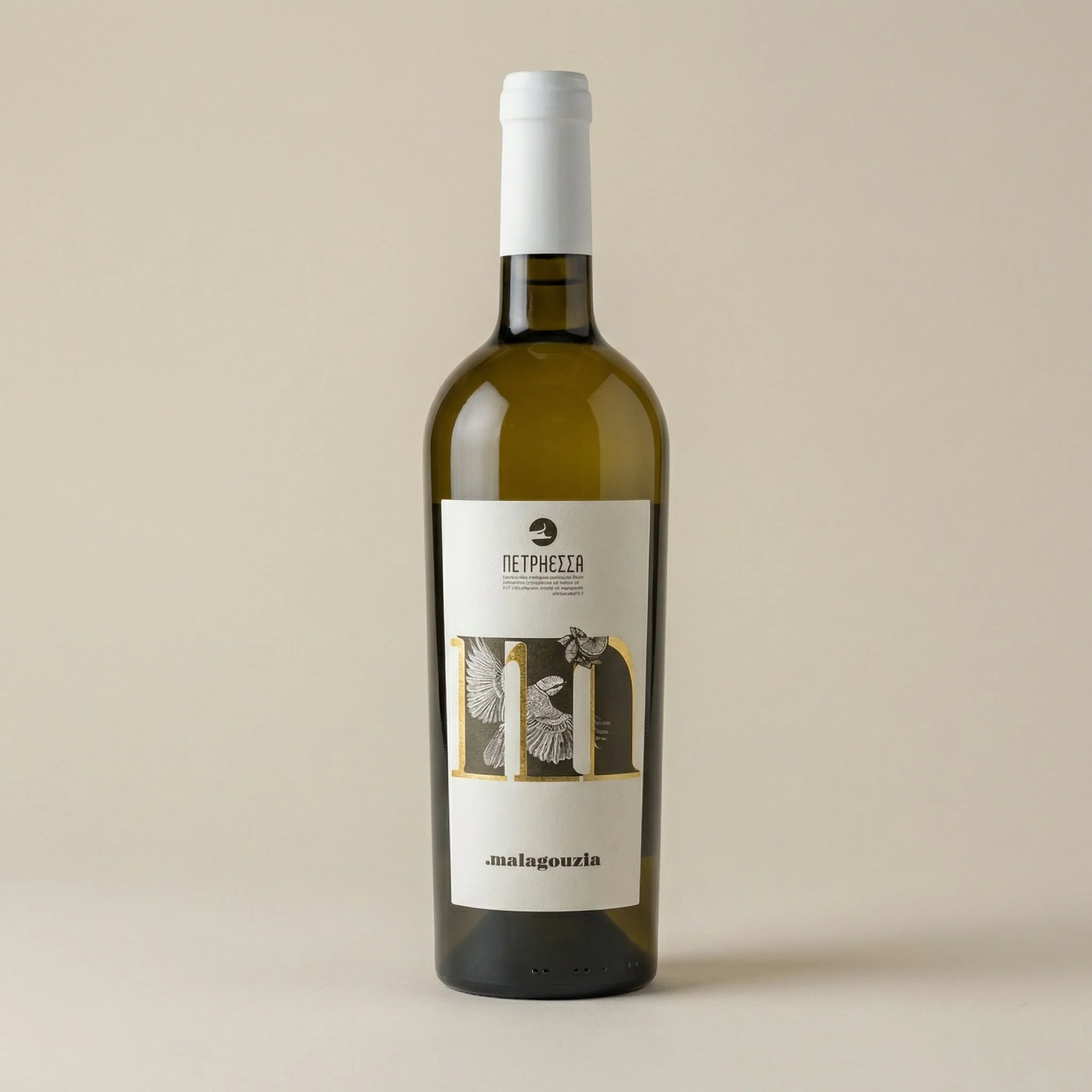 A white wine bottle with Greek text and artistic illustrations of birds on the label, set against a plain background.
