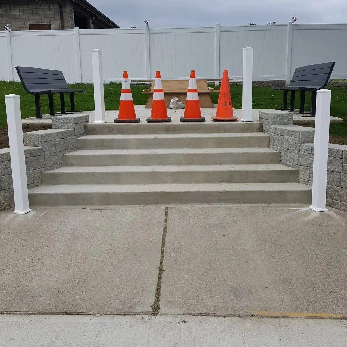 block a staircase with two benches on either side, poured concrete, steps, block work, blockwork,