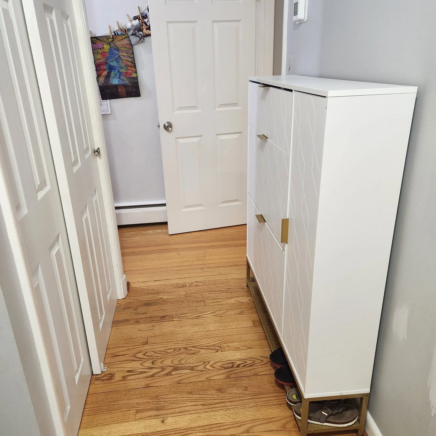 ✨ Front Hall &amp; Closet Makeover! ✨ We swapped out the messy shoe pile for a nice shoe cabinet, making everything look so much neater! We added labeled bins on top of the closet for easy access to hats, gloves, and accessories, plus sturdy matching