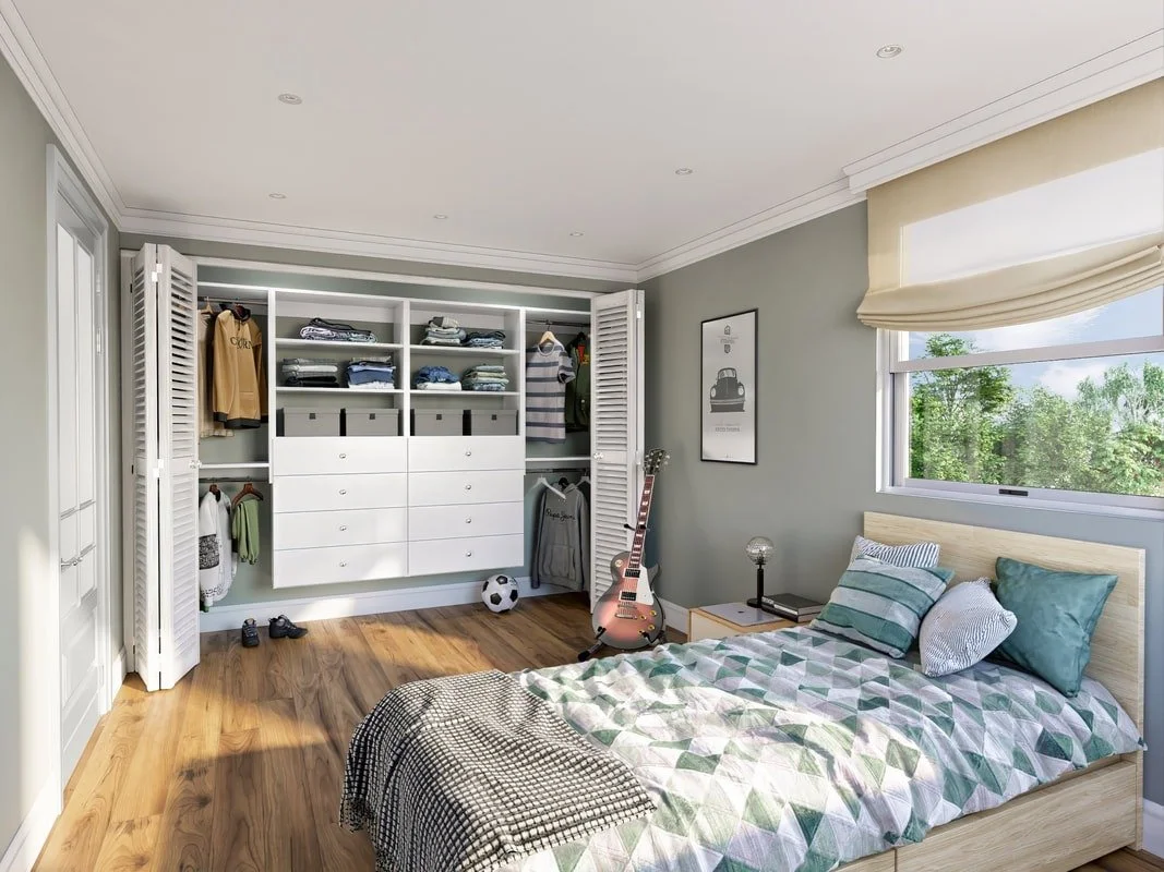 A bedroom with a bed, a nightstand, a guitar, a window showing trees outside, and an open closet with clothes, boxes, and shoes.