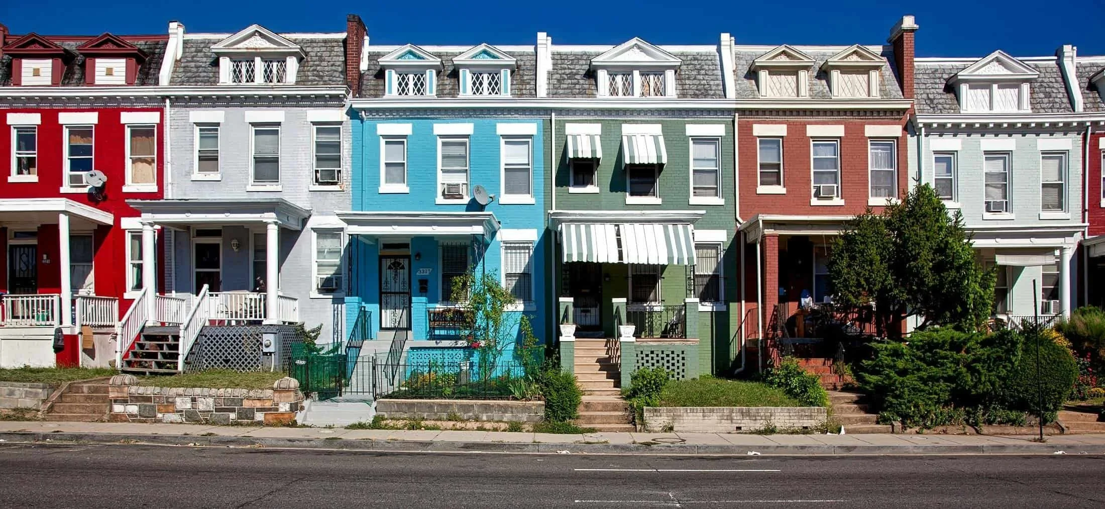 Colorful rowhomes in the Greater Baltimore area representing neighborhoods served by Declutter Together professional organizing services.