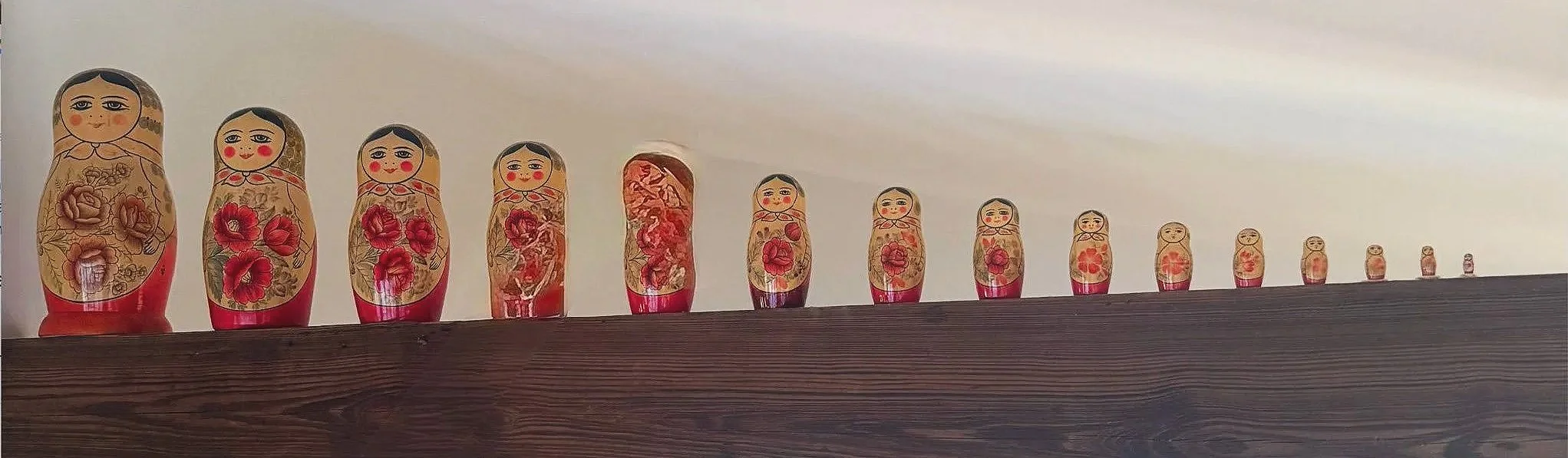  Hidden surprises . A small thrill unfolds with each turn of the hand—anticipation yielding to delight, revealed one layer at a time. Collecting Russian Dolls is a beloved pastime!
