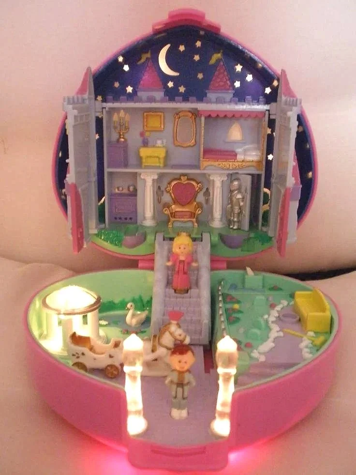 Polly Pocket & Tamagotchis; the enchantment of  little worlds  that you can hold in the palm of your hand. Carry them with you.
