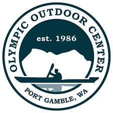 Logo of Olympic Outdoor Center in Port Gamble, Washington, established in 1986, featuring a mountain, a person kayaking, and a circular border.