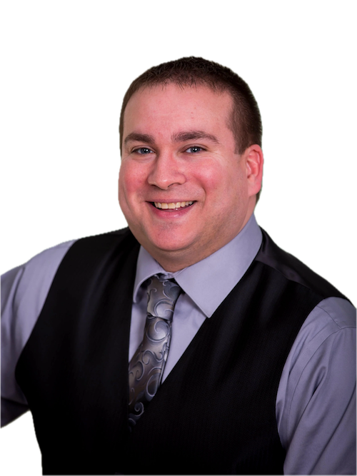 Portrait of a smiling man in a gray shirt, black vest, and patterned tie.