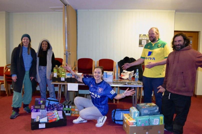 Norwich Jamaica Aid volunteers with donated supplies and raffle prizes supporting hurricane relief efforts in Jamaica