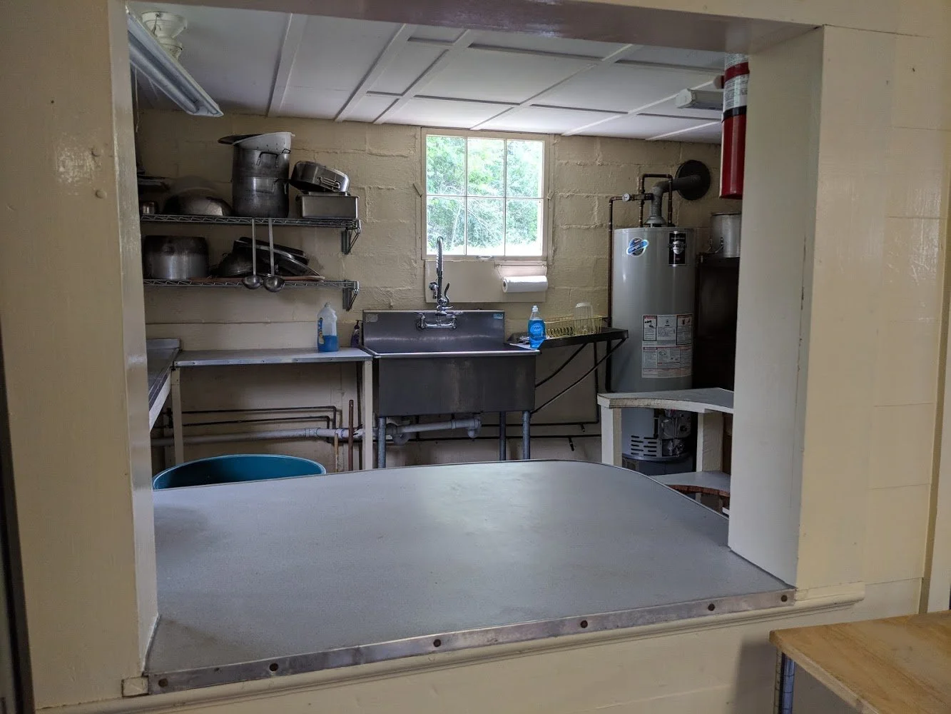 Kitchen includes large coffee urn
