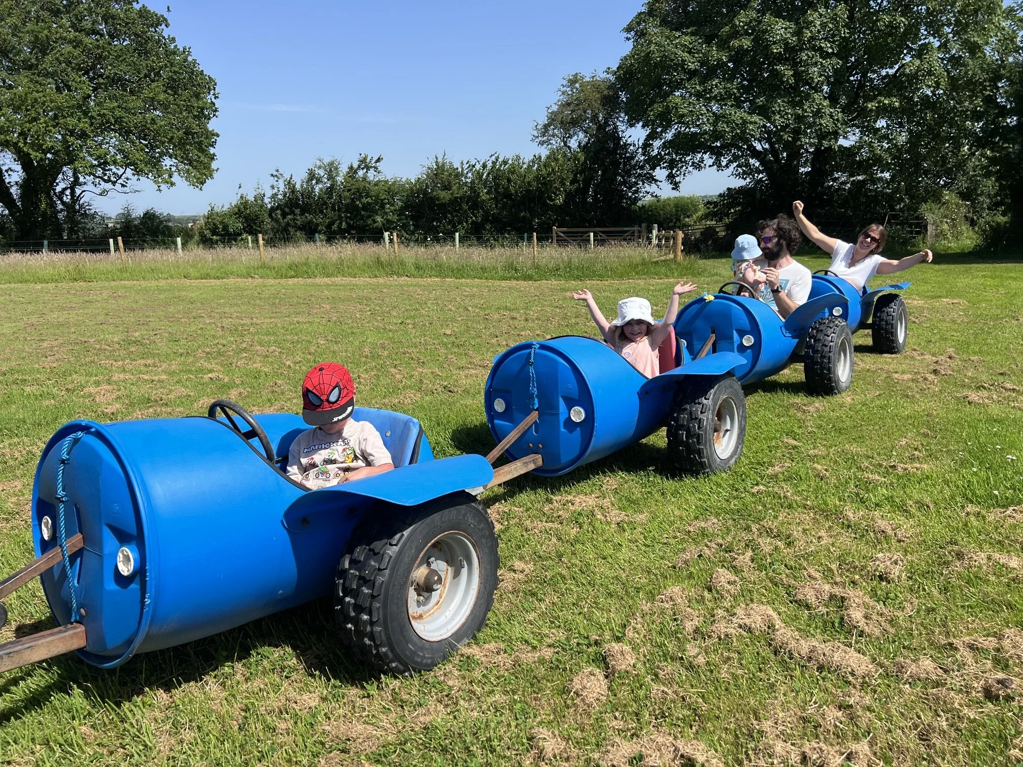 Visitors riding in barrel ride