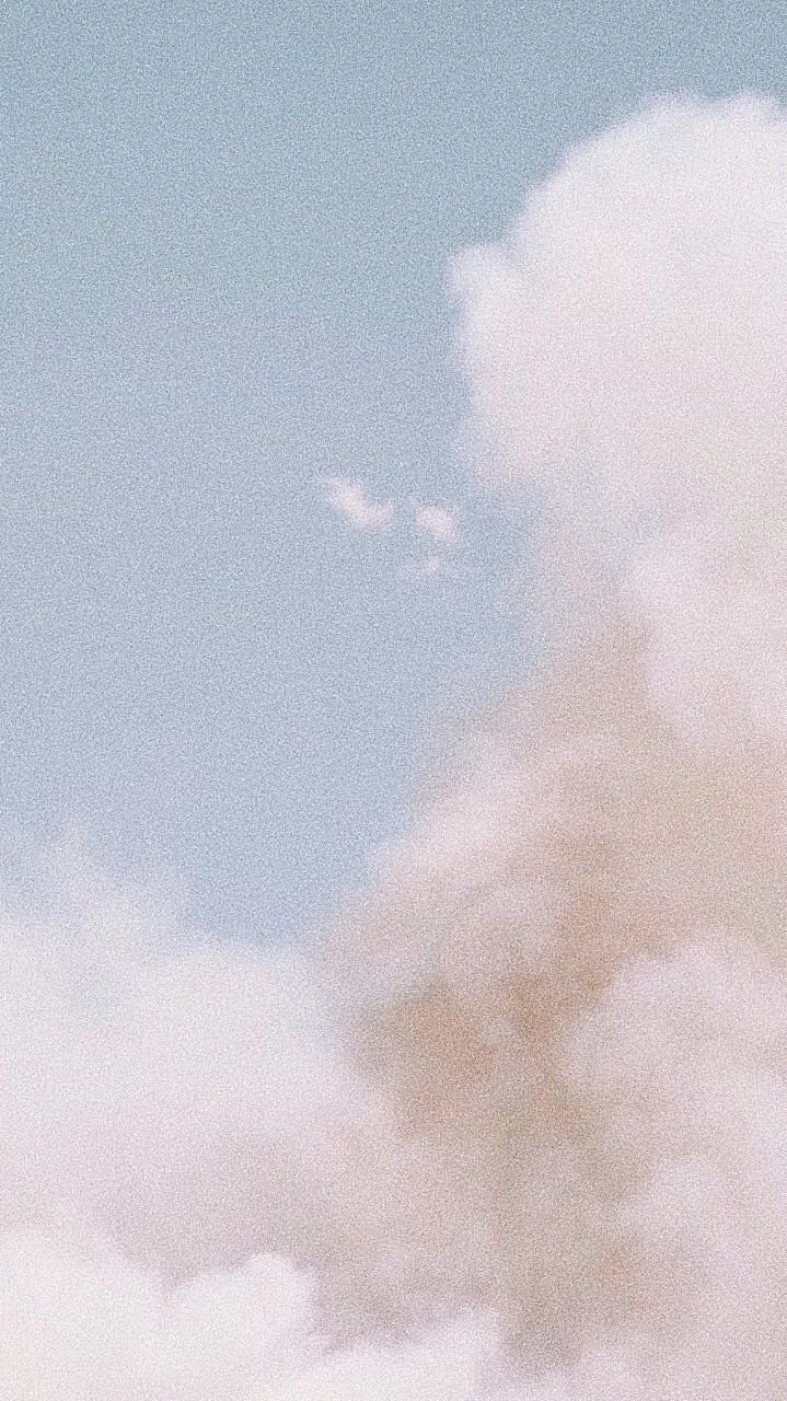 Clouds in the sky with some smoke or haze.