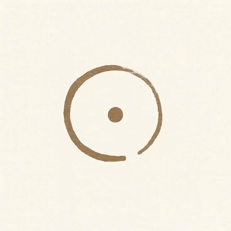 Simple circular design with a dot in the center and an uneven circle outline, resembling a minimalistic clock or target.