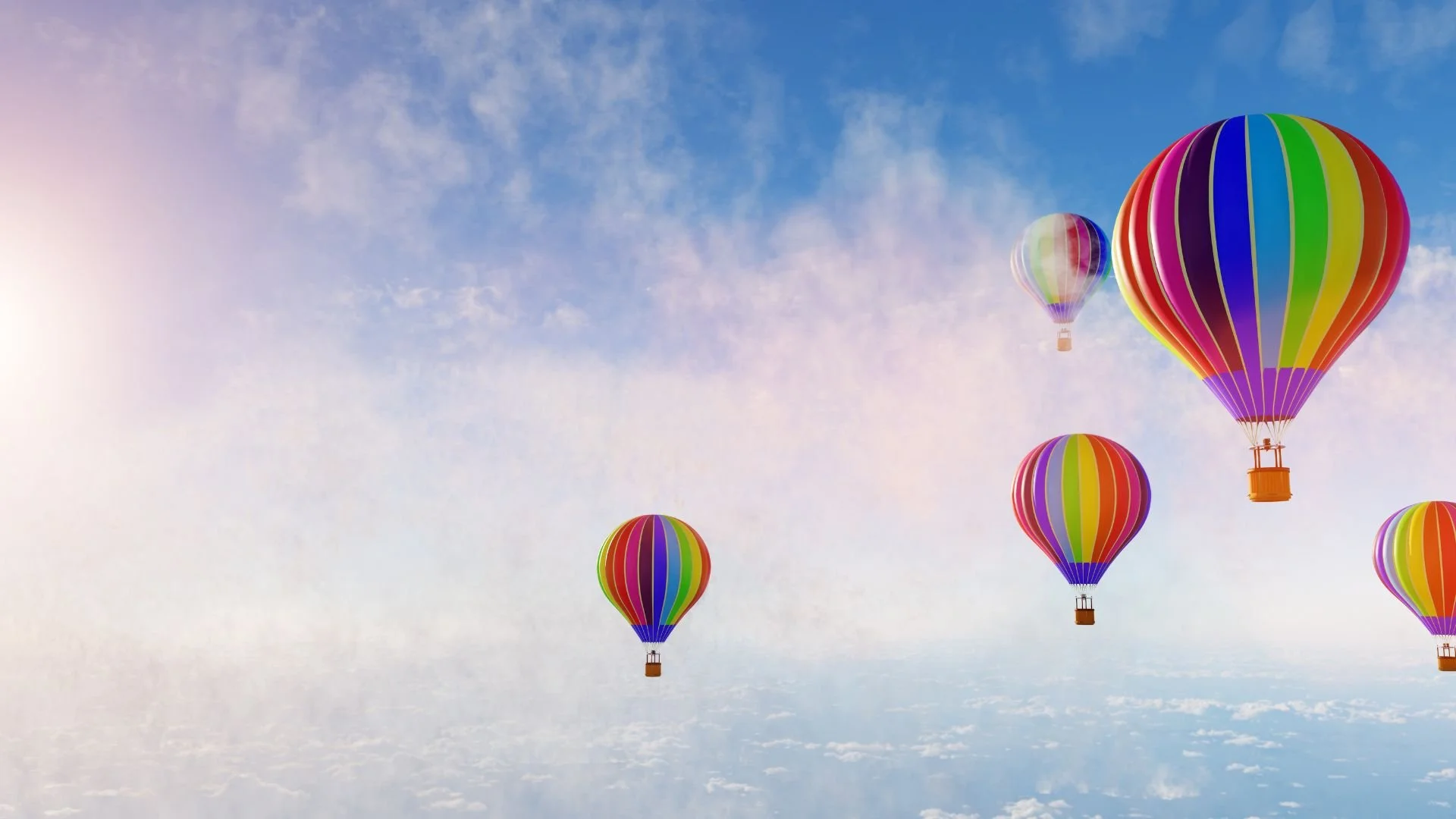 5 ballons montgolfières très colorés dasn un ciel bleu avec nuages blancs, illustrant la méditation pour enfants Ballon magique de 6 minutes dans Zen découverte, invitant l'enfant à explorer les couleurs et l'imaginaire à travers des respirations.