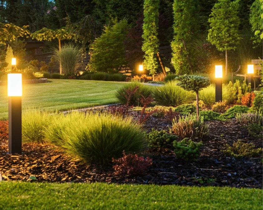 Vivid landscape design with landscape lighting, lawn, mulch with plants built and designed by Bend Oregon landscaping company