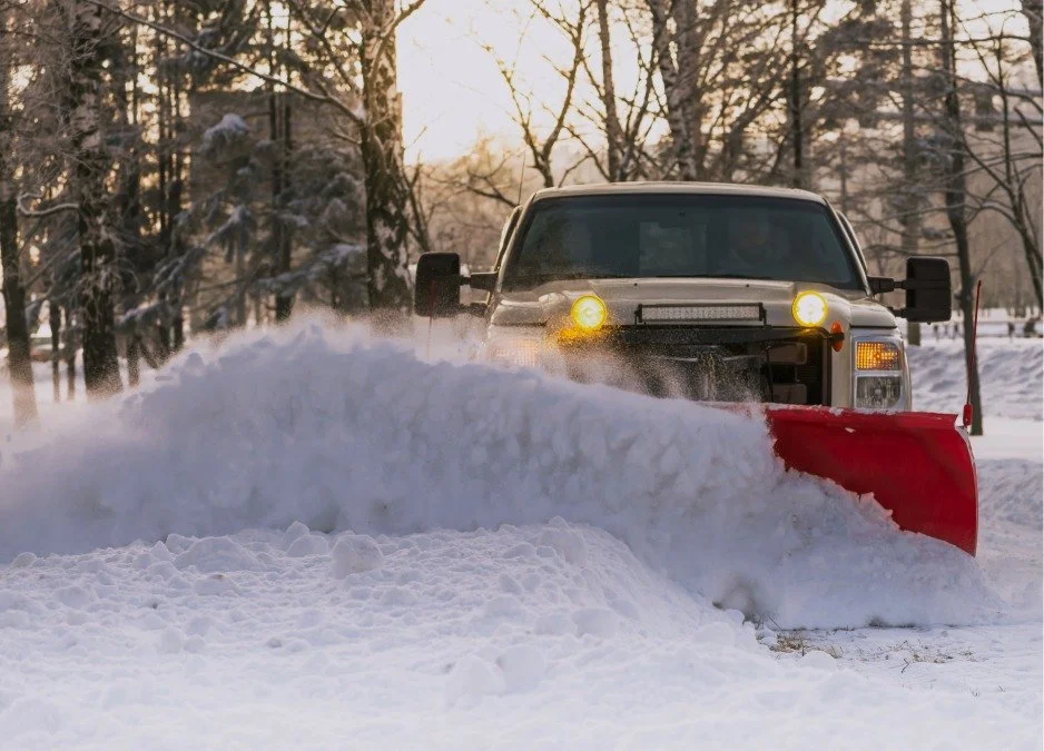 Snow removal truck pushing snow as part of snow removal service in Bend Oregon