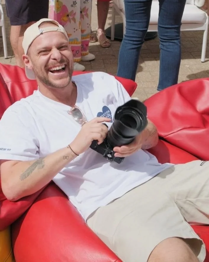 Photographer Jack with camera in hand for Yours.haus