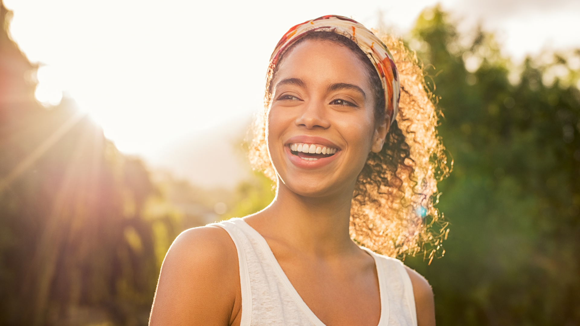 Smiling woman representing a friendly and approachable healthcare experience.