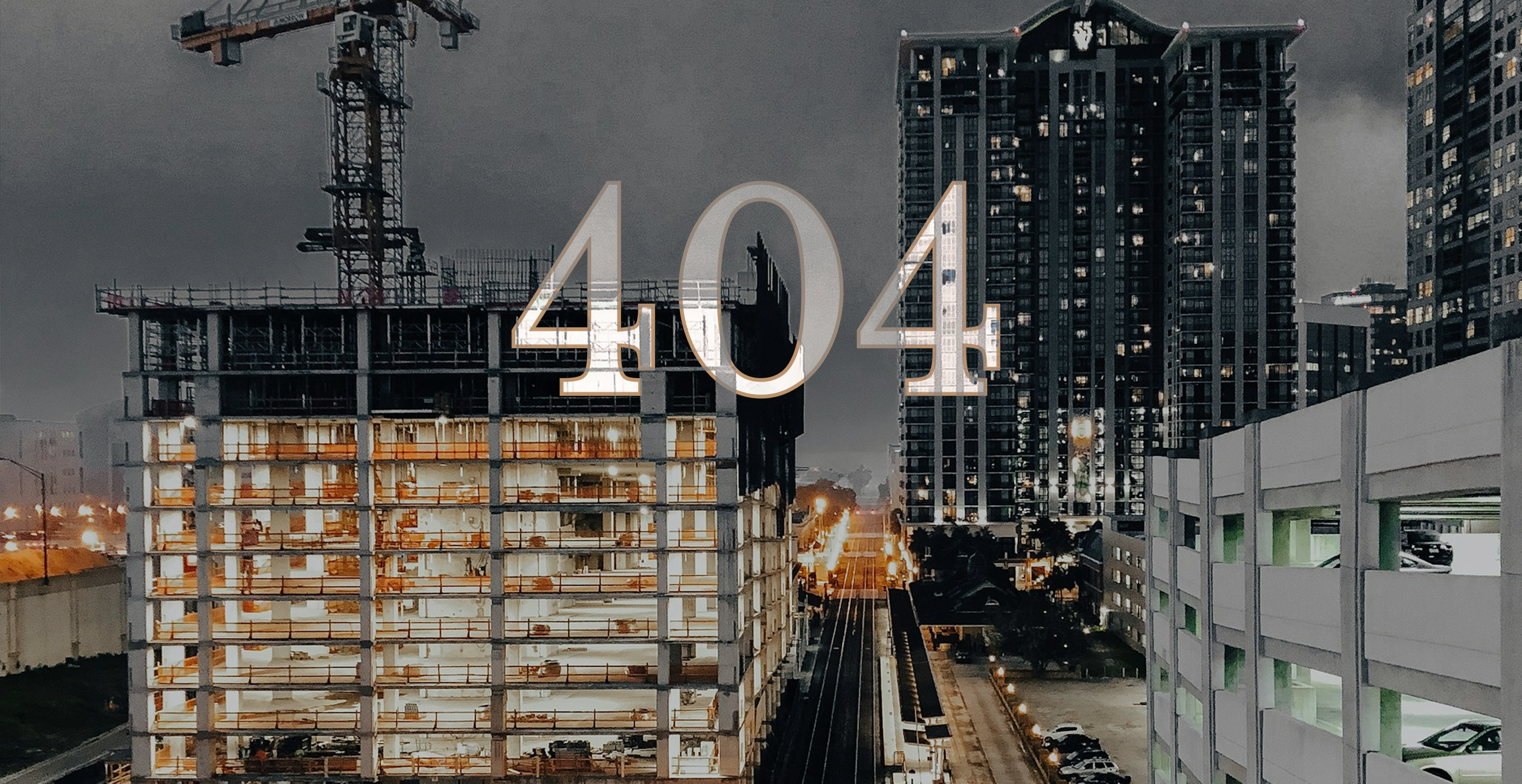 Cityscape of tall buildings under a dark, cloudy sky, with a construction site on the left and illuminated streets below, overlaid with the text '404' in large, transparent font.
