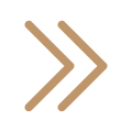 Two gold-colored arrows pointing to the right on a black background.