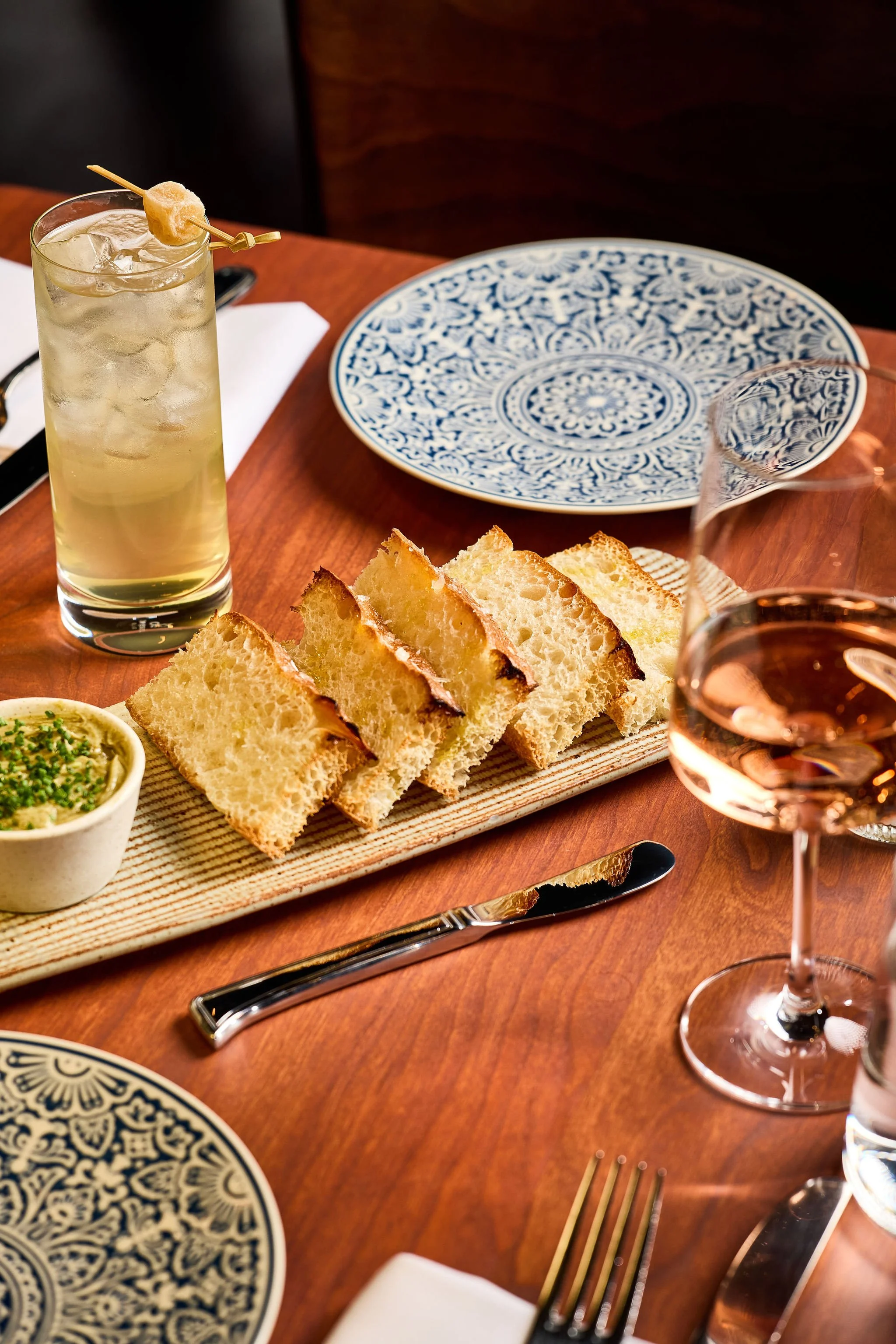 bread and butter with cocktails and wine