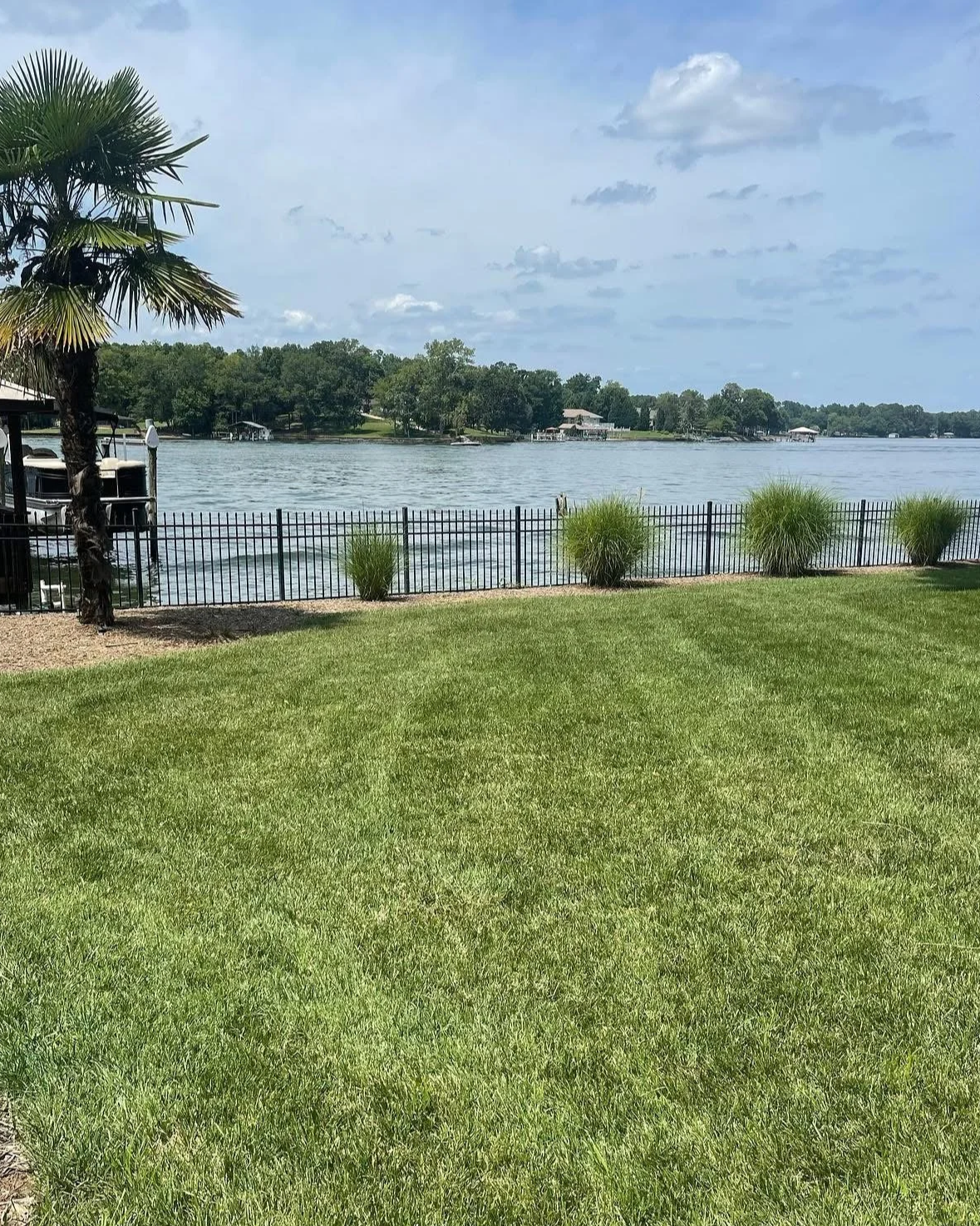 Healthy green grass lawn at lake-front propert