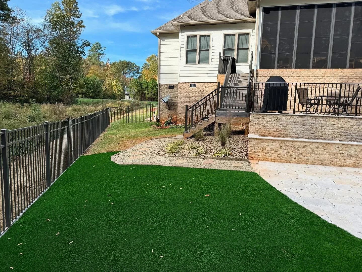 Artificial turf with stone patio