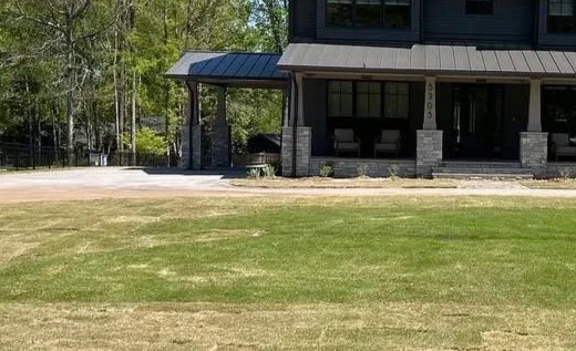 Graded front lawn with irrigation system installed