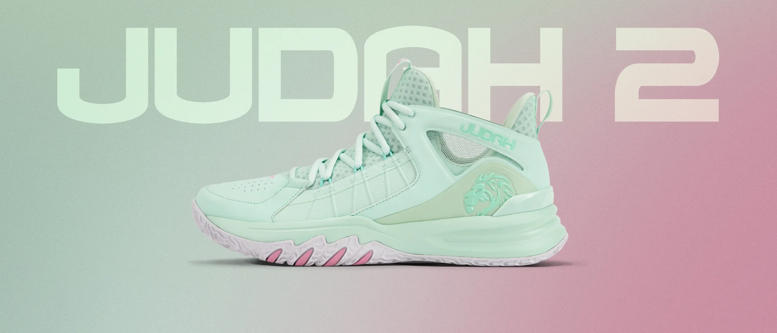 Light green athletic shoe with a lion logo and