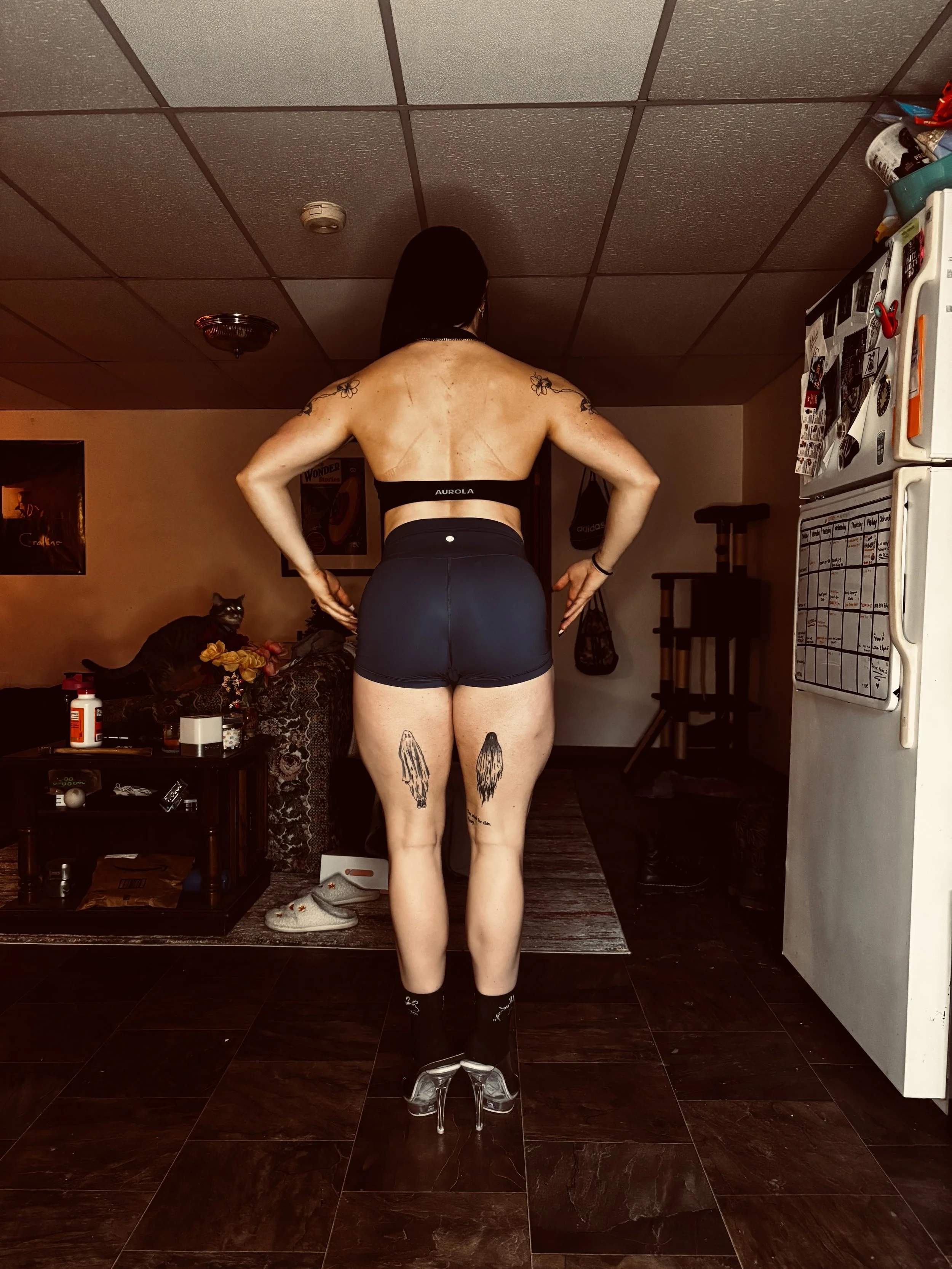 personal trainer performing a back pose for npc figure posing practice for bodybuilding