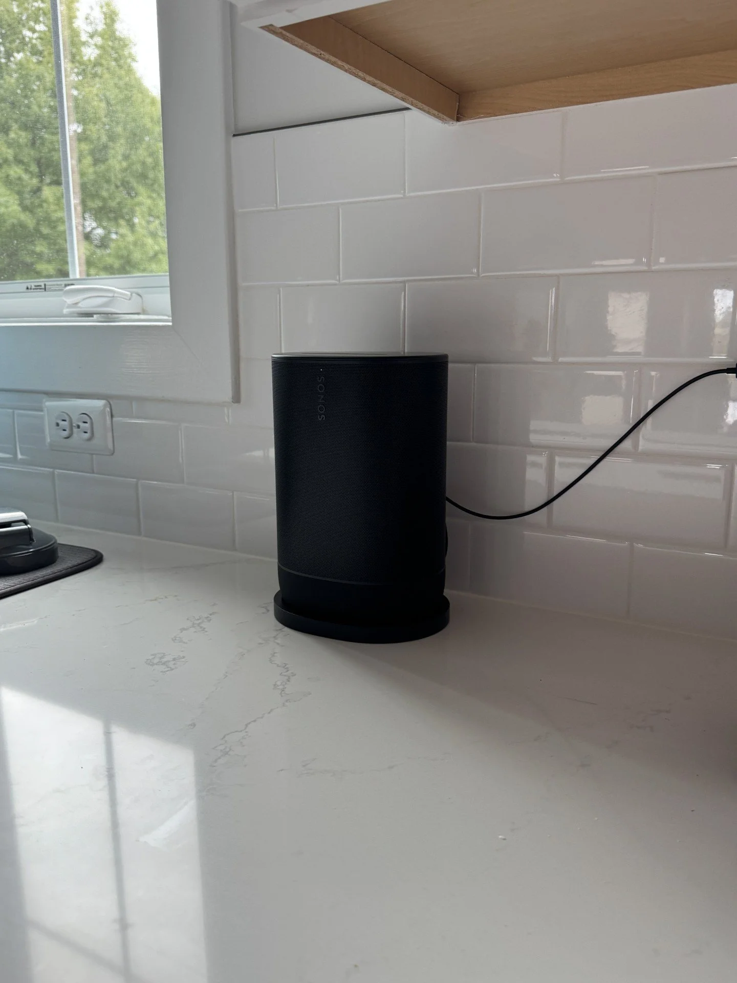Sonos Roam installed and professionally configured on top of a kitchen counter.