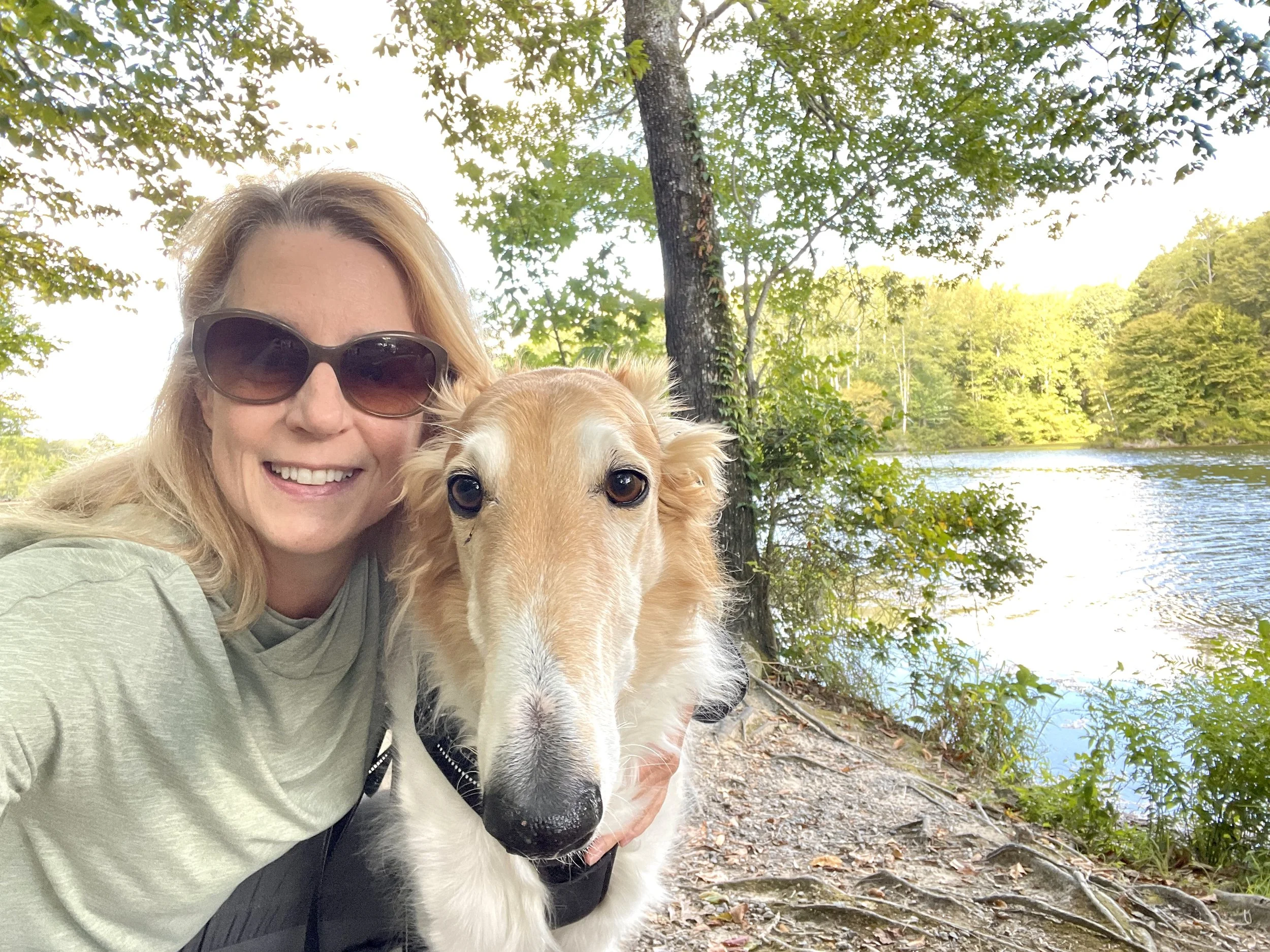 Brooke Sabin hiking in Virginia with borzoi Misha