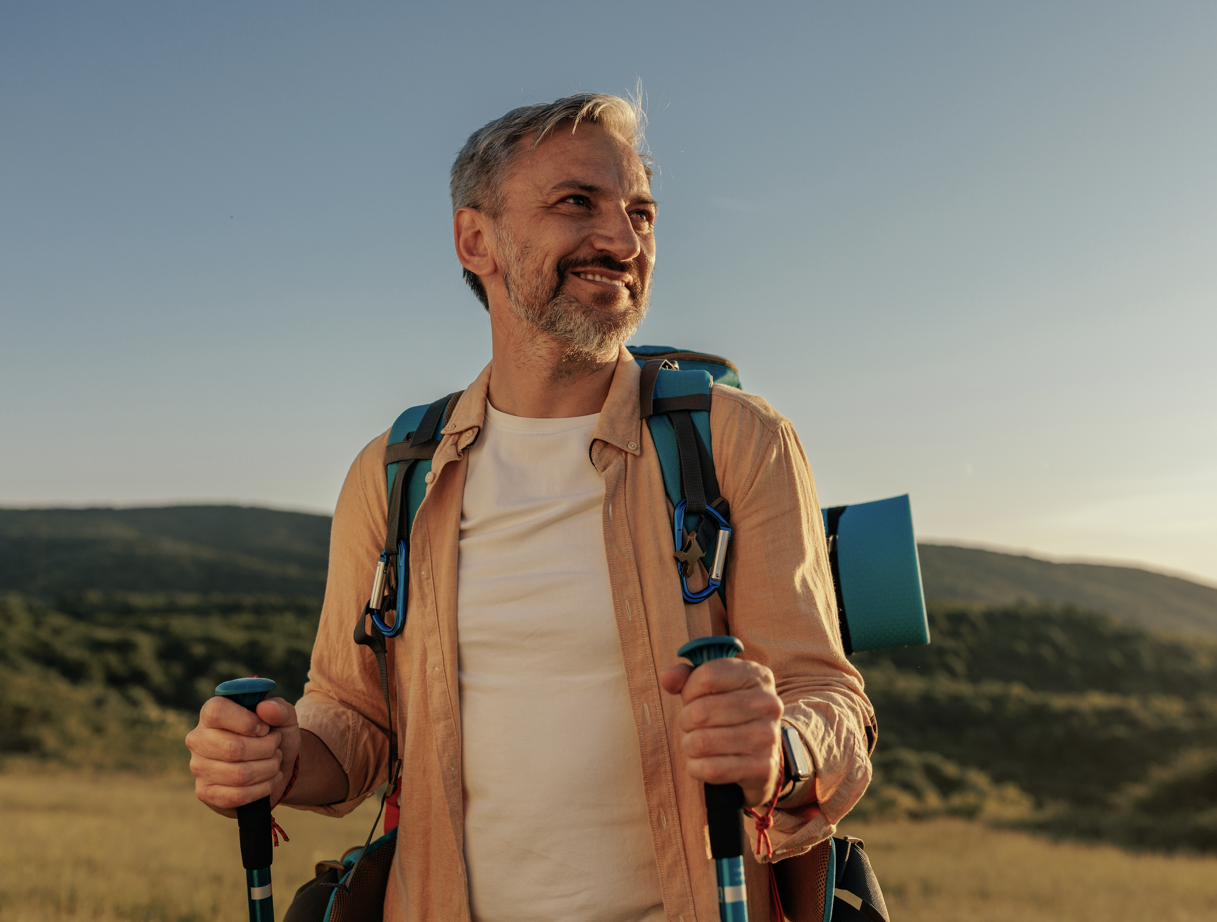 Man hiking in the Southwest desert, reflecting an active outdoor lifestyle.