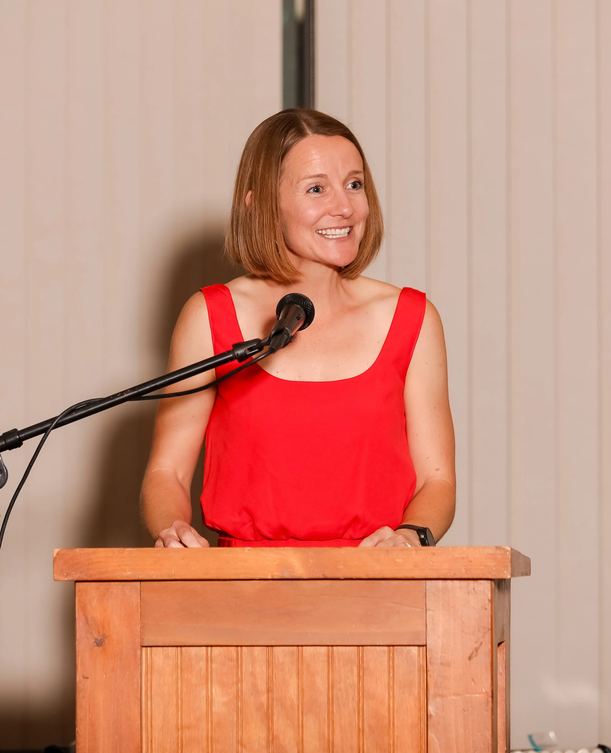 Davena speaking during a professional presentation.