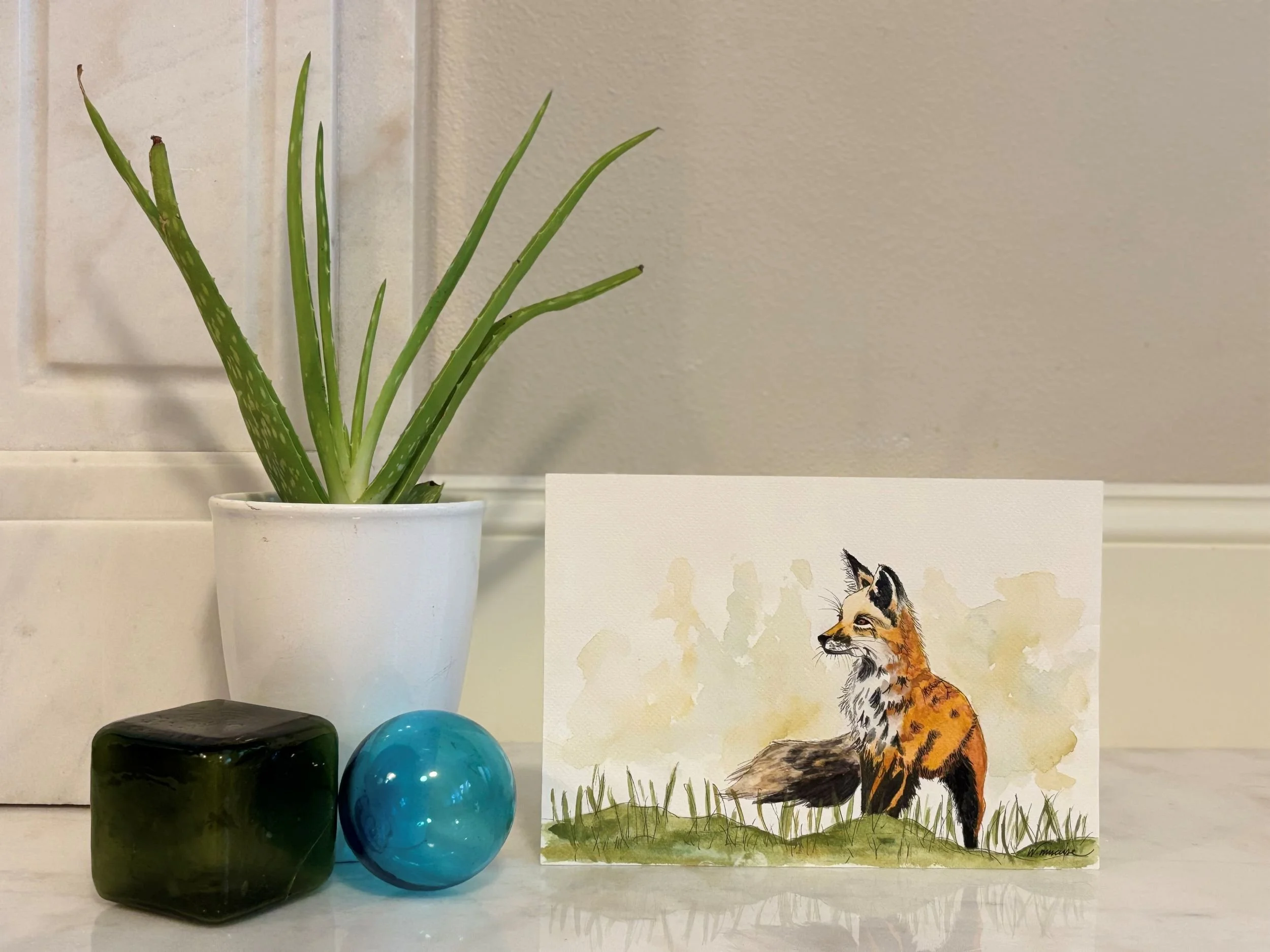 Detail of Todd fox watercolor painting showing the fox's alert gaze and delicate line work
